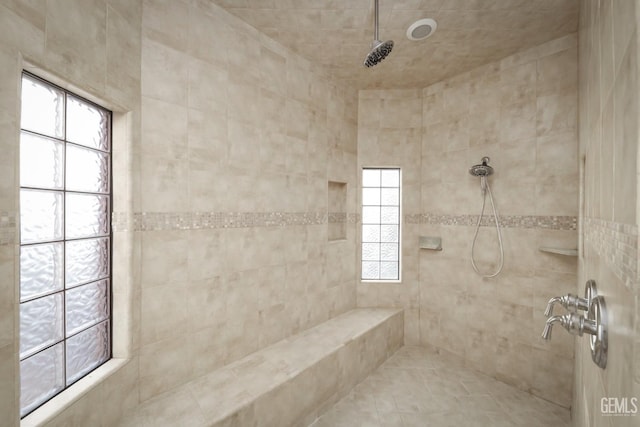 bathroom with a tile shower