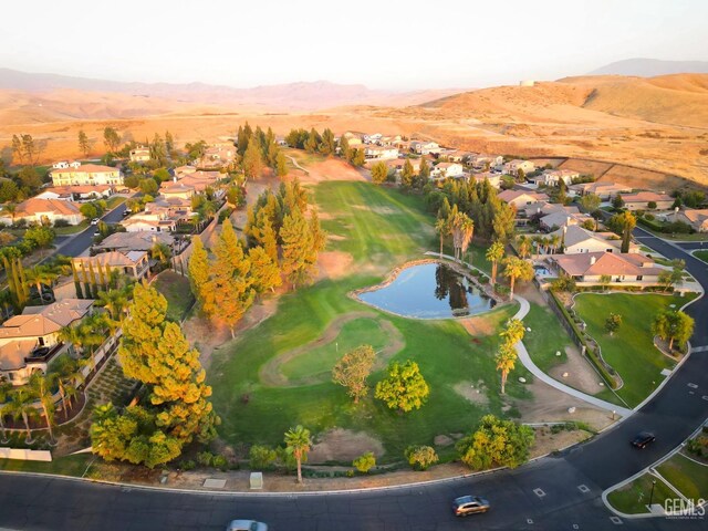 birds eye view of property with a mountain view