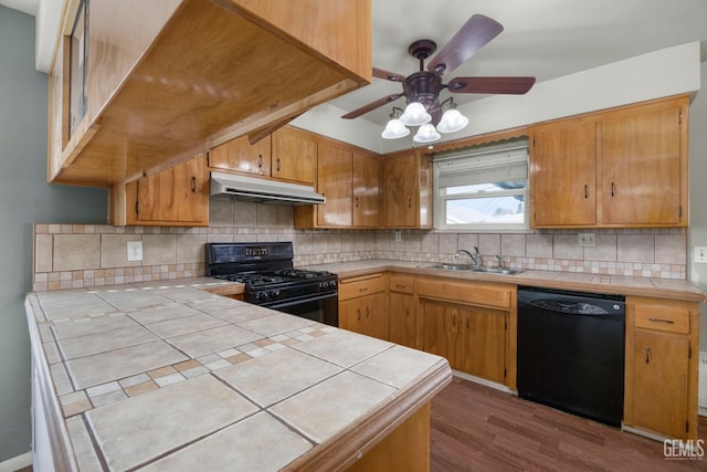 1909 Carrere St, Bakersfield, CA 93308 - kitchen featuring under cabinet range hood, a sink, tile countertops, a ceiling fan, and black appliances