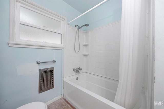 1909 Carrere St, Bakersfield, CA 93308 - full bath featuring shower / tub combo with curtain, heating unit, toilet, and tile patterned floors