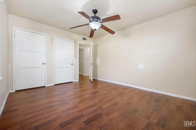 1909 Carrere St, Bakersfield, CA 93308 - unfurnished bedroom with dark wood-style floors, visible vents, and baseboards