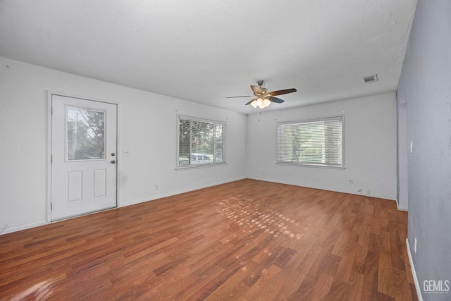 1909 Carrere St, Bakersfield, CA 93308 - unfurnished room with baseboards, visible vents, wood finished floors, and a ceiling fan