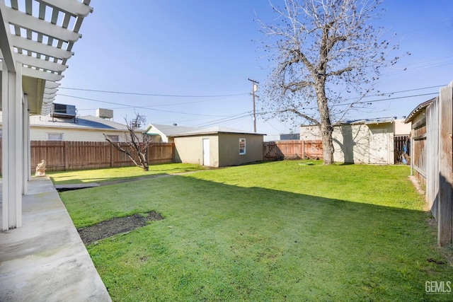 1909 Carrere St, Bakersfield, CA 93308 - view of yard featuring a fenced backyard, central air condition unit, an outbuilding, and a pergola