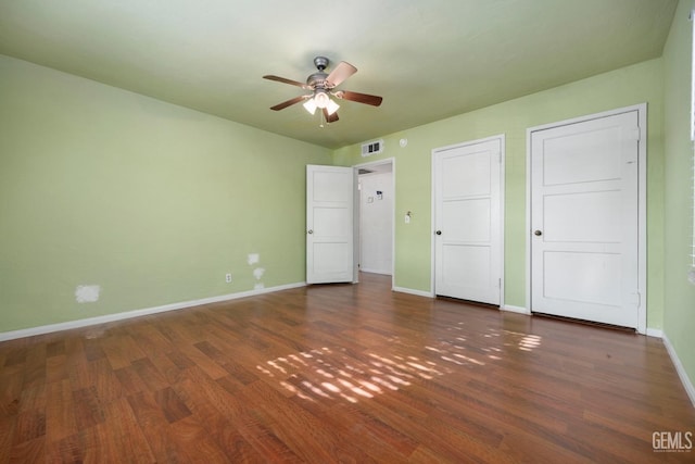 1909 Carrere St, Bakersfield, CA 93308 - unfurnished bedroom featuring visible vents, baseboards, ceiling fan, and wood finished floors