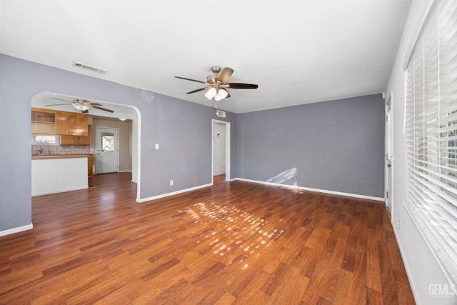 1909 Carrere St, Bakersfield, CA 93308 - spare room featuring visible vents, wood finished floors, arched walkways, and ceiling fan