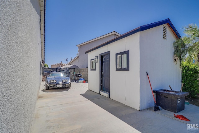 6800 Eagle Cap St, Bakersfield, CA 93313 - view of home's exterior with a patio area and an outdoor structure