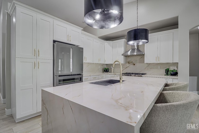 6800 Eagle Cap St, Bakersfield, CA 93313 - kitchen featuring appliances with stainless steel finishes, backsplash, white cabinetry, and light stone countertops