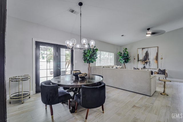 6800 Eagle Cap St, Bakersfield, CA 93313 - dining space featuring light wood finished floors, lofted ceiling, a chandelier, and french doors
