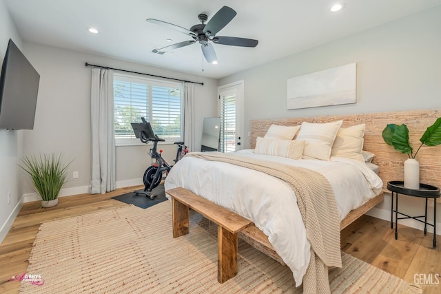 bedroom featuring ceiling fan and light hardwood / wood-style flooring