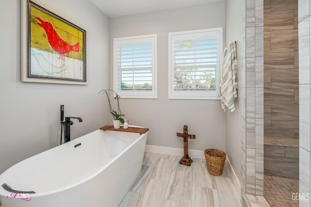 bathroom with separate shower and tub