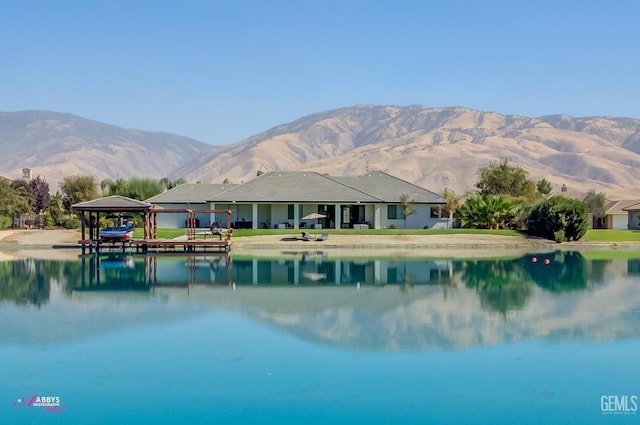 view of pool with a water and mountain view