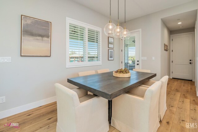 dining area with light wood-type flooring