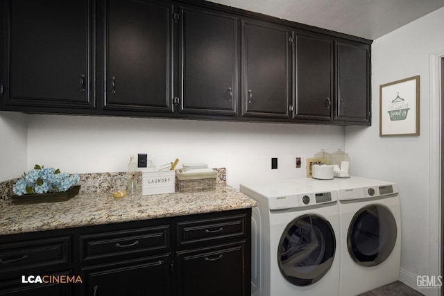 laundry area with cabinets and washer and clothes dryer