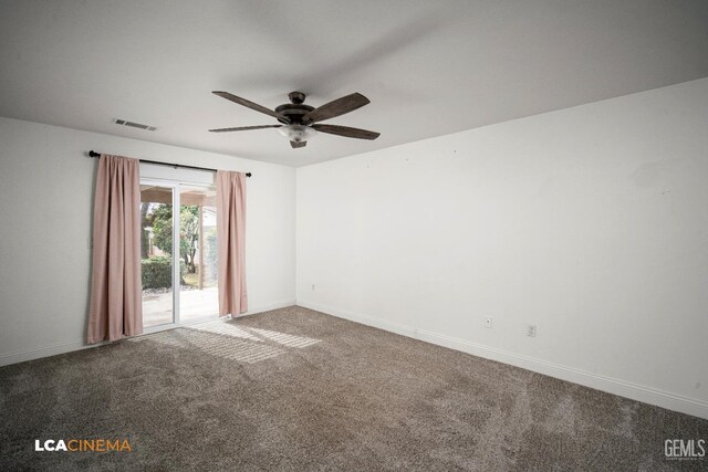 carpeted spare room with ceiling fan