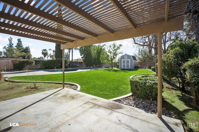 view of yard featuring a patio, a pergola, and a storage shed