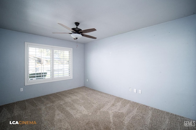 spare room featuring ceiling fan and carpet flooring