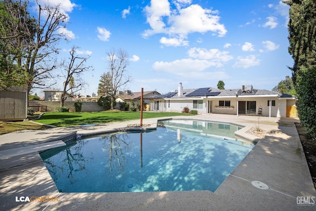 view of swimming pool with a patio area and a lawn