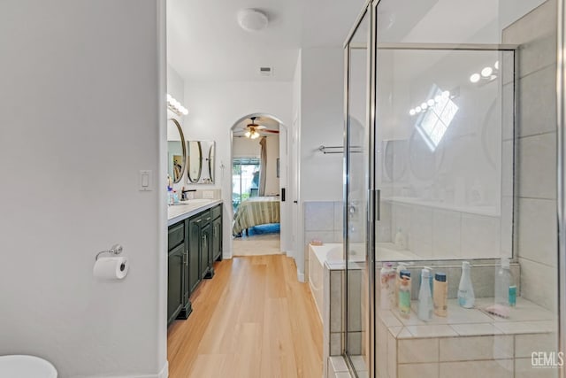 11602 Marazion Hill Ct, Bakersfield, CA 93311 - ensuite bathroom featuring vanity, a shower stall, connected bathroom, a ceiling fan, and wood finished floors