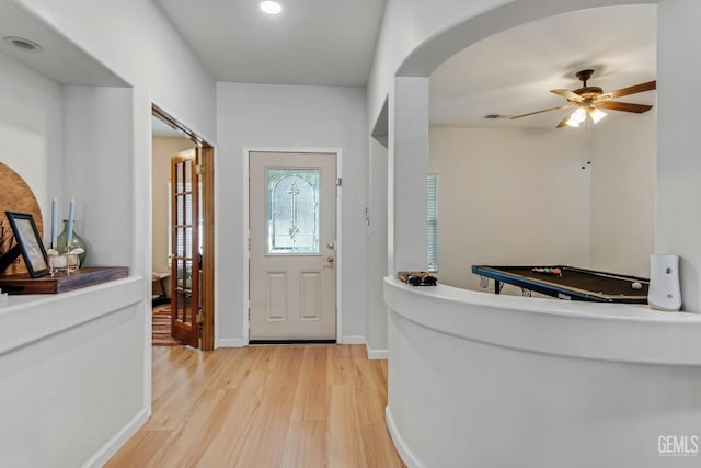 11602 Marazion Hill Ct, Bakersfield, CA 93311 - entrance foyer featuring baseboards, ceiling fan, arched walkways, and light wood-type flooring