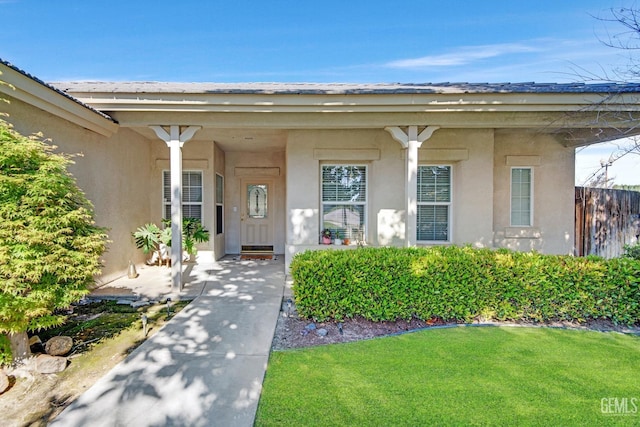 11602 Marazion Hill Ct, Bakersfield, CA 93311 - doorway to property with stucco siding and a yard