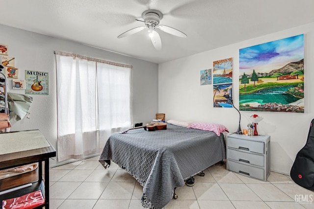 tiled bedroom with ceiling fan