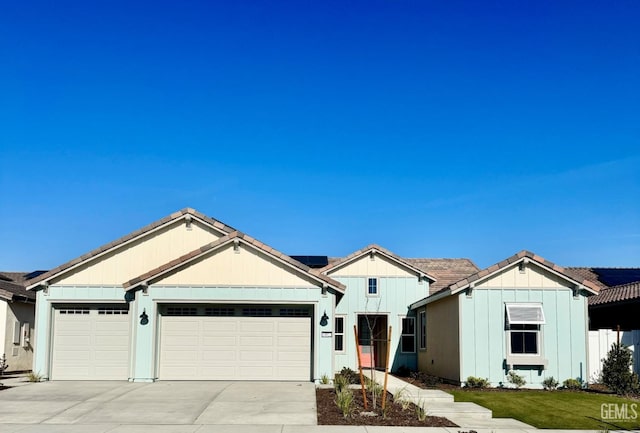 view of front of property with a garage and a front yard