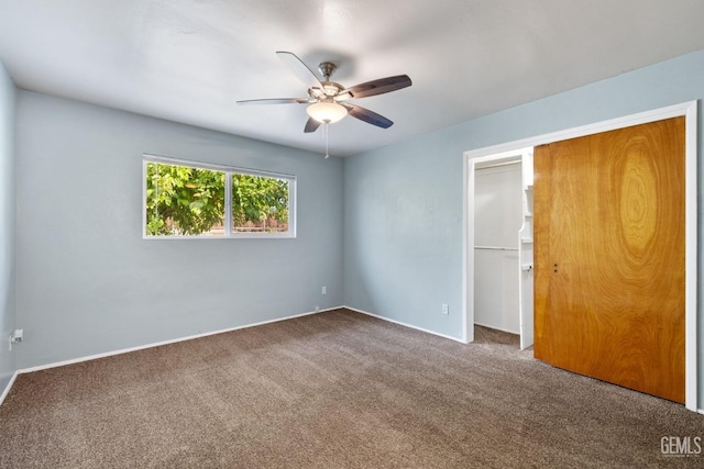 unfurnished bedroom featuring ceiling fan, carpet floors, and a closet