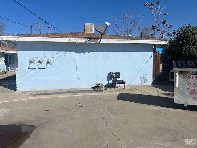 view of side of property featuring a patio