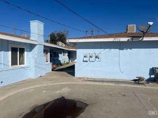 view of side of home featuring a patio area