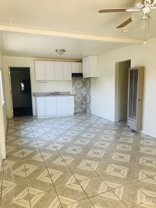 1026 Height St, Bakersfield, CA 93305 - kitchen featuring white cabinetry, ceiling fan, and a heating unit
