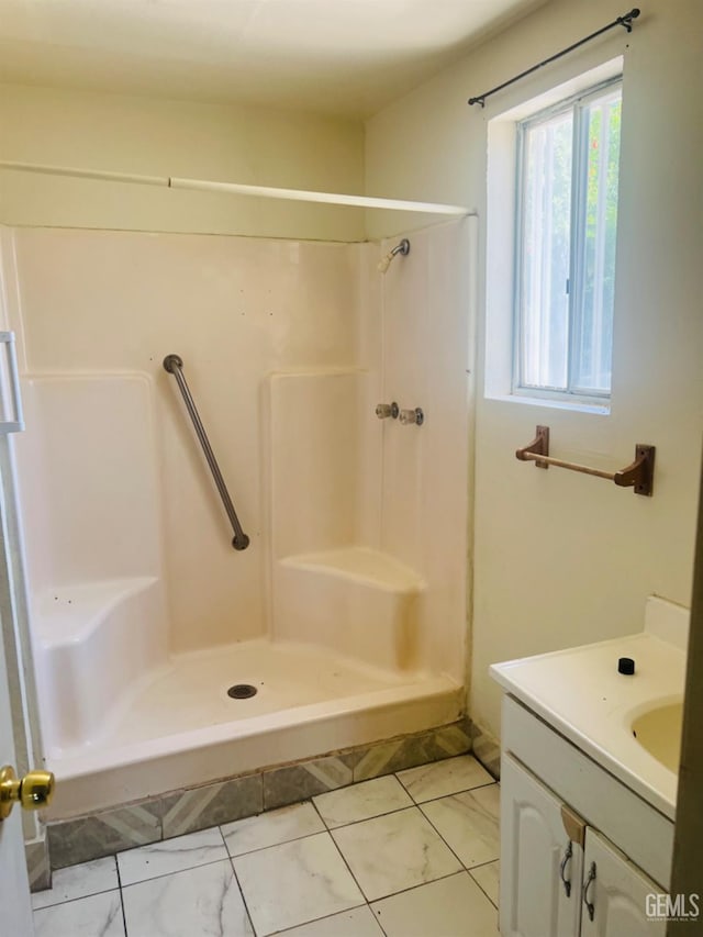 1026 Height St, Bakersfield, CA 93305 - full bathroom featuring vanity, a shower, and marble finish flooring