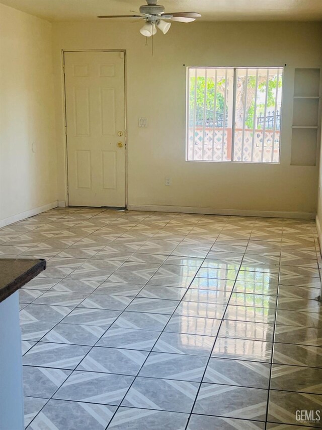 1026 Height St, Bakersfield, CA 93305 - empty room with baseboards and a ceiling fan