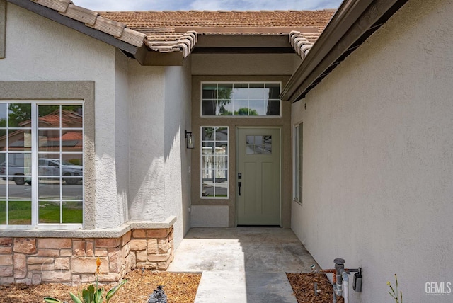 3702 Bedrock Dr, Bakersfield, CA 93311 - property entrance with stucco siding and a tile roof