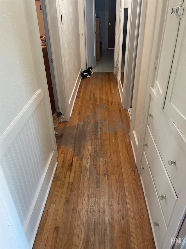 corridor featuring hardwood / wood-style flooring