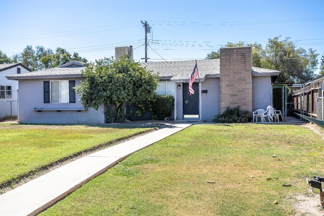 single story home with a front yard