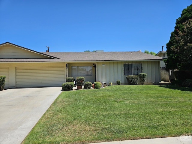 5708 Cypress Point Dr, Bakersfield, CA 93309 - ranch-style house with board and batten siding, an attached garage, driveway, and a front lawn