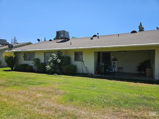 5708 Cypress Point Dr, Bakersfield, CA 93309 - rear view of house featuring a patio area, stucco siding, and a yard
