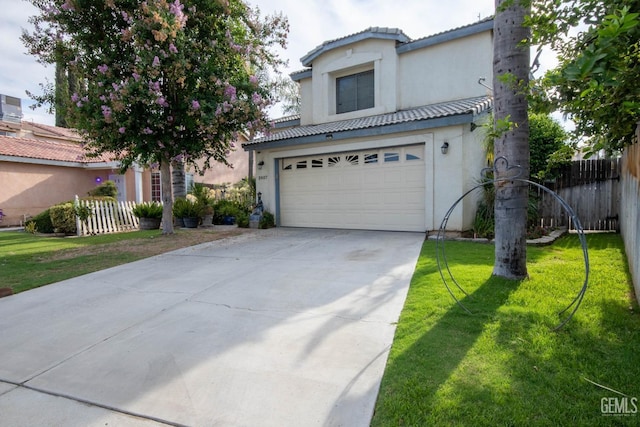 view of front of house with a front yard and a garage