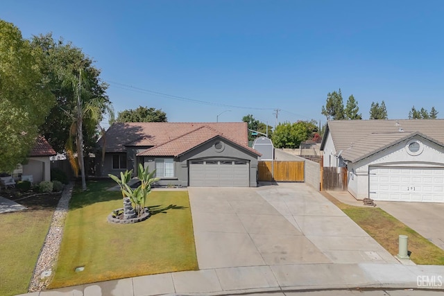 12017 Hannah Denise Ave, Bakersfield, CA 93312 - ranch-style home with a tile roof, concrete driveway, and stucco siding