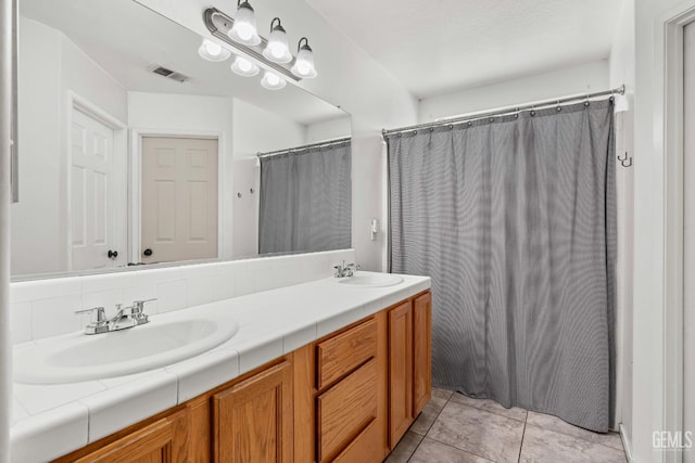 12017 Hannah Denise Ave, Bakersfield, CA 93312 - bathroom featuring double vanity and curtained shower