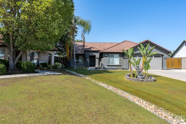 12017 Hannah Denise Ave, Bakersfield, CA 93312 - view of front of property featuring stucco siding, concrete driveway, a tiled roof, and an attached garage