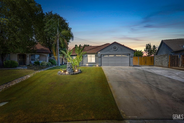 12017 Hannah Denise Ave, Bakersfield, CA 93312 - view of front facade featuring concrete driveway, a garage, stucco siding, and a tile roof