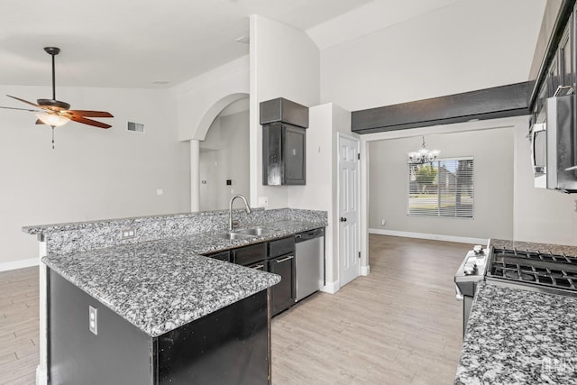 12017 Hannah Denise Ave, Bakersfield, CA 93312 - kitchen featuring appliances with stainless steel finishes, ceiling fan, light wood-style floors, a peninsula, and arched walkways