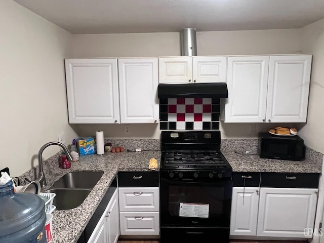 kitchen featuring white cabinets and black range with gas stovetop