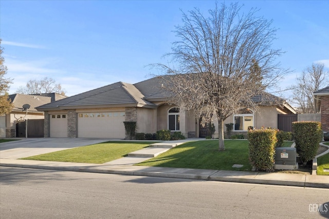 view of front of property with a front lawn and a garage