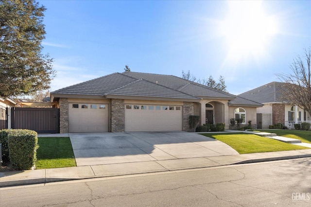 view of front of property with a garage and a front yard