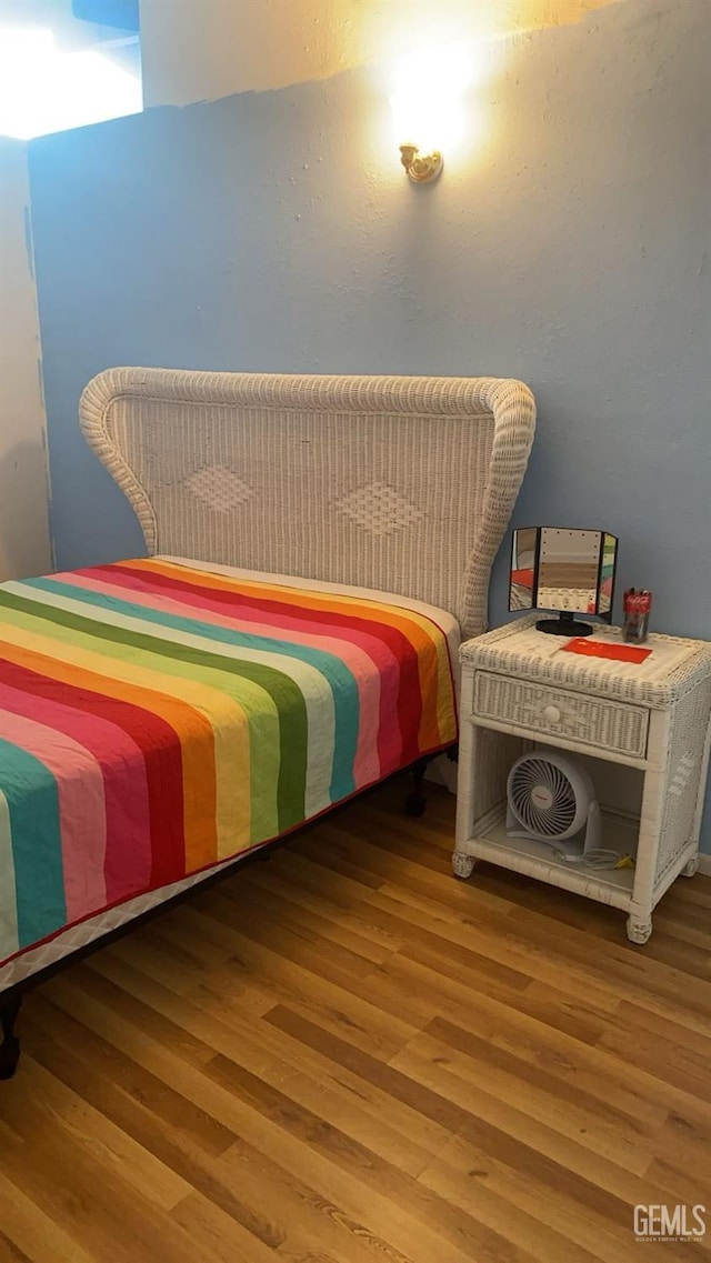 bedroom featuring wood finished floors