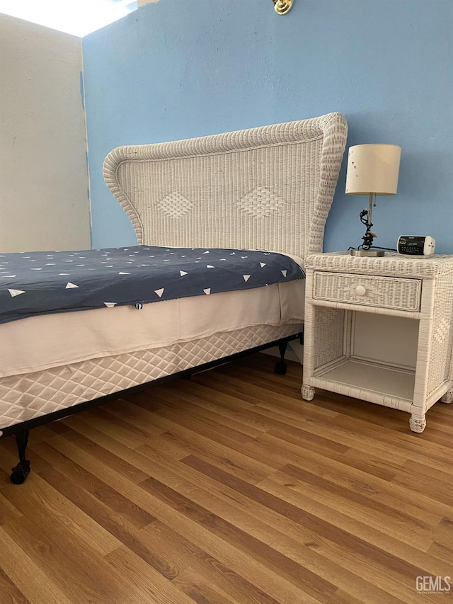 bedroom with wood finished floors