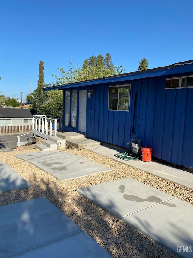 exterior space with a patio and board and batten siding
