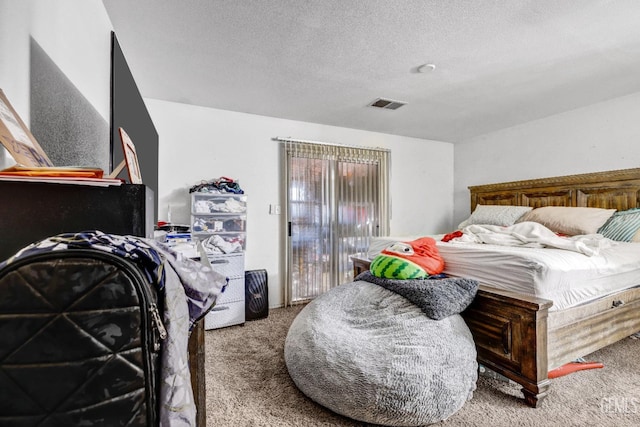 carpeted bedroom with a textured ceiling